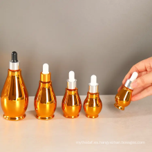 Botellas de cuentagotas de suero de oro esencial cosmético de aceite esencial